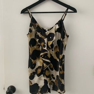 CaBI camisole.In good shape with one slight snag but hardly noticeable!